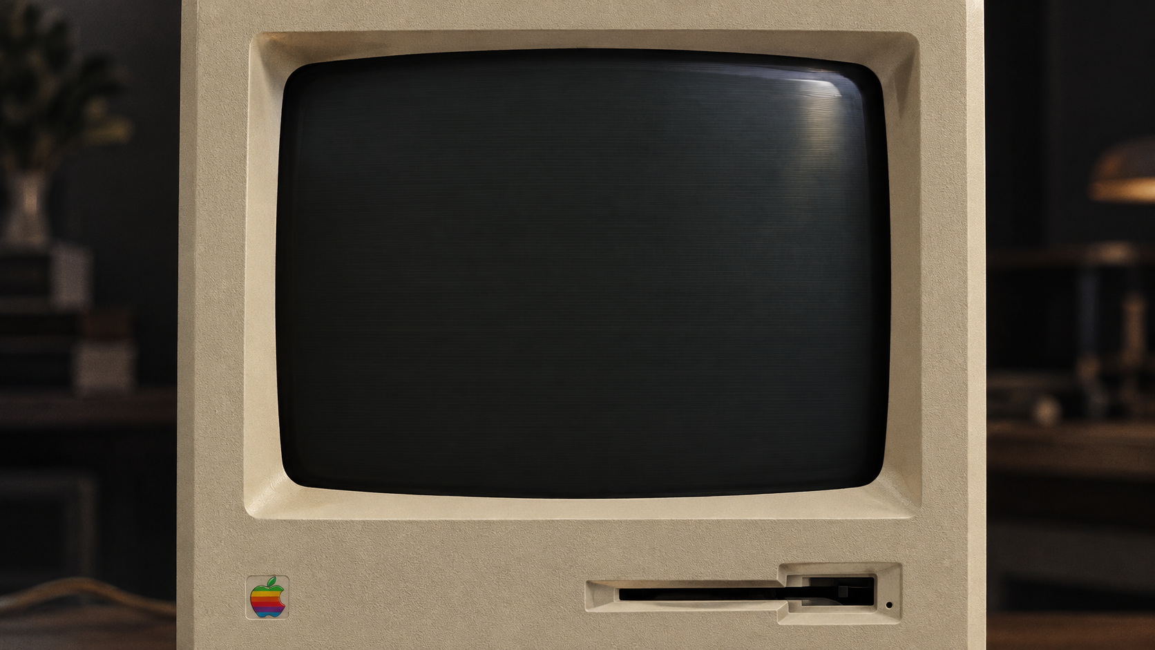 正面 Macintosh，深色 CRT 屏幕